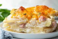 Creamy Scalloped Potatoes with Ham and Cheesy Garlic Crust