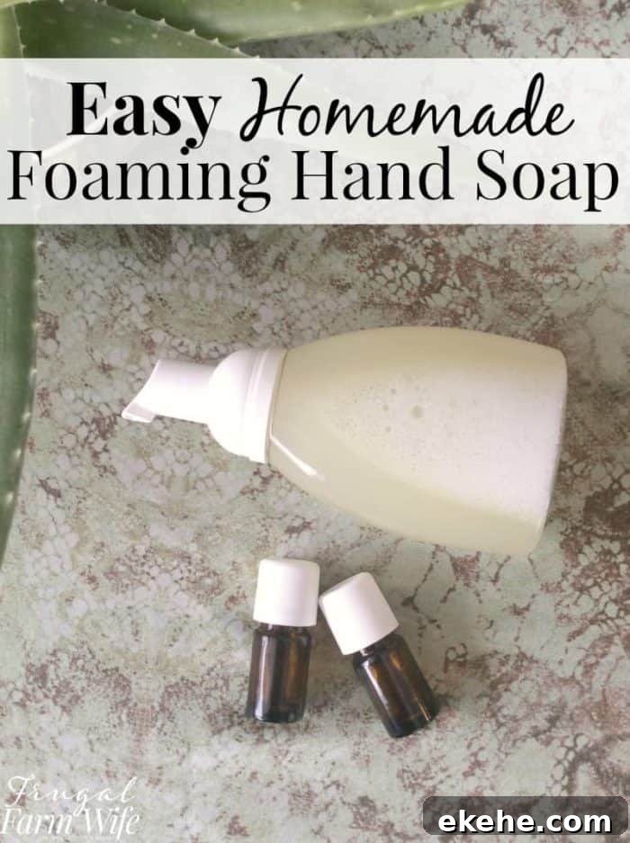 Image shows hand soap, essential oils vials, and text that reads 'Easy Homemade Foaming Hand Soap'
