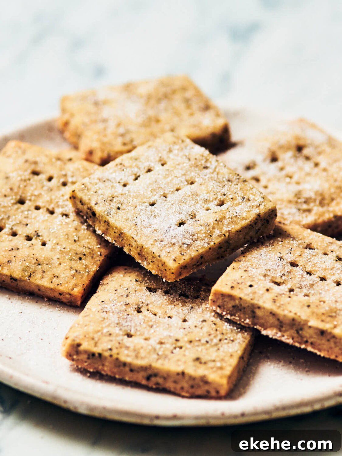 Best Earl Grey Shortbread cookies, sprinkled with sugar, on a while plate