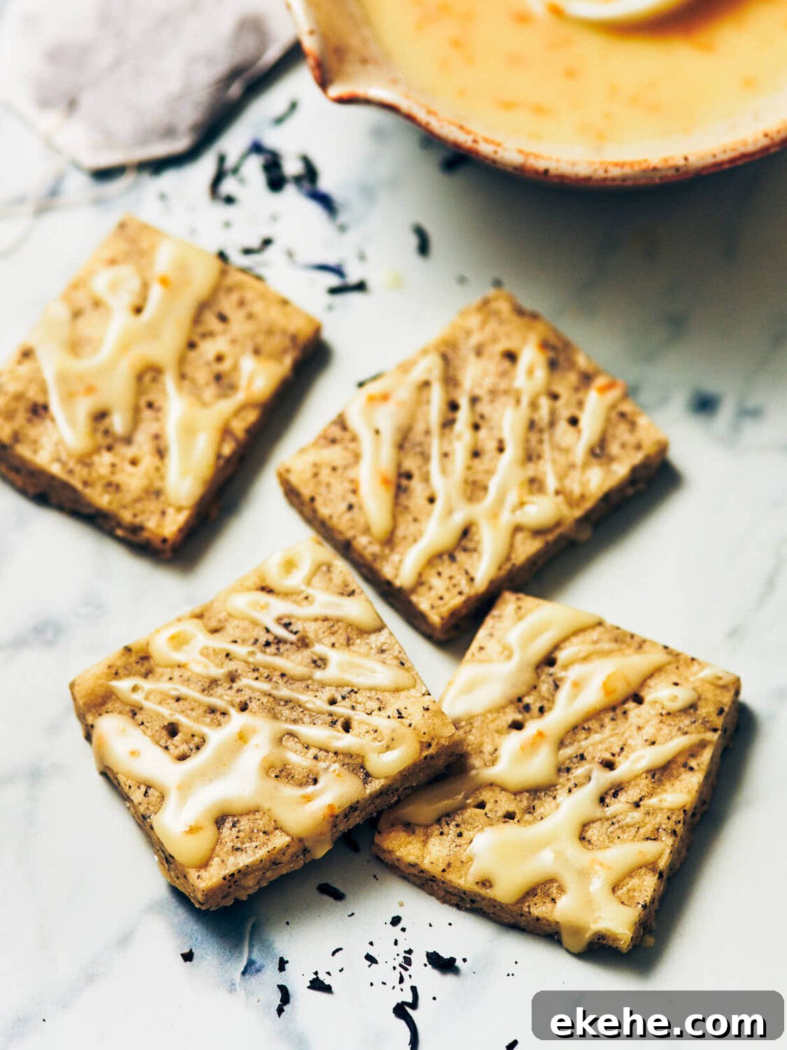 Best Earl Grey Shortbread cookies drizzled with orange royal icing.