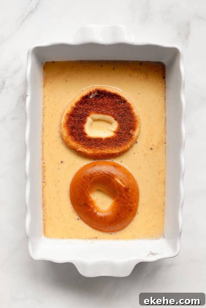 how to soak a bagel in french toast milk, cinnamon, and egg mixture