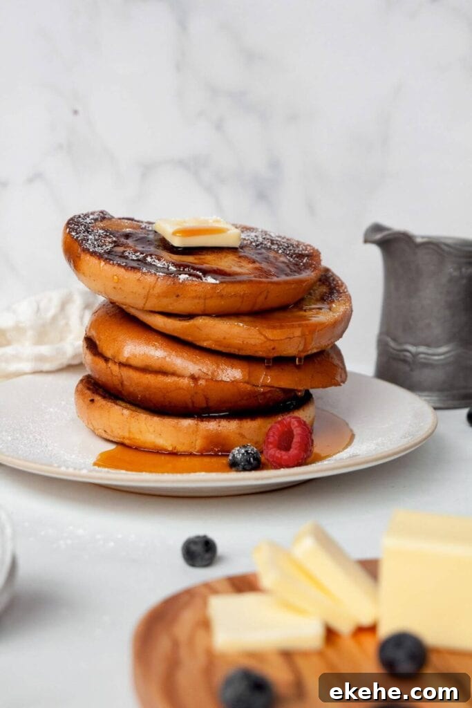 bagel French toast with maple syrup and fresh berries