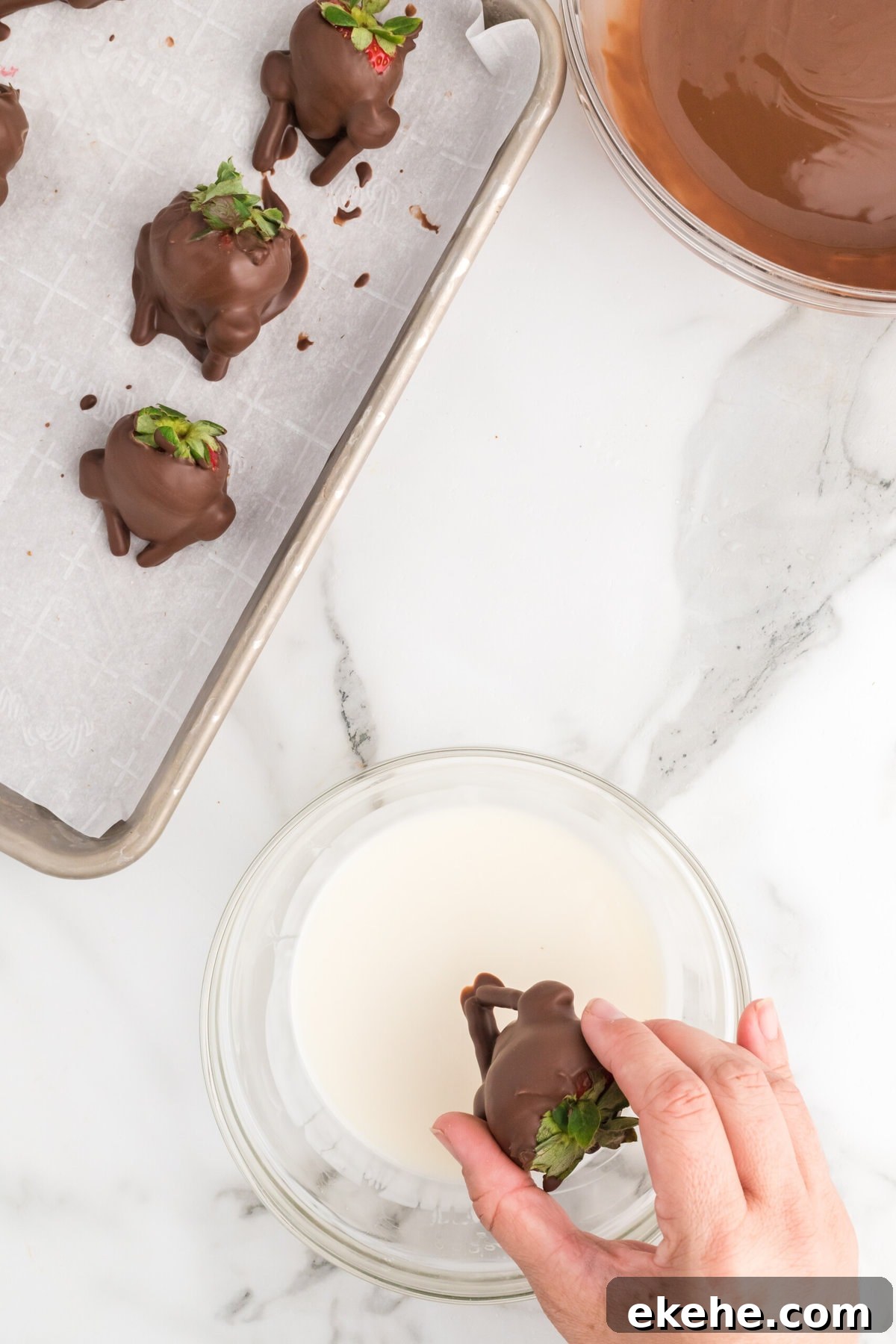 Dipping the feet of the turkey in white chocolate.