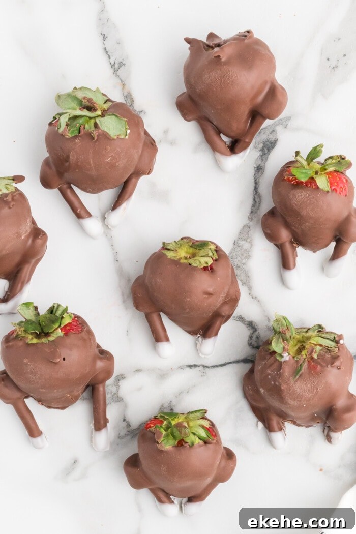 Chocolate-Covered Strawberry Turkeys on a marble white table.