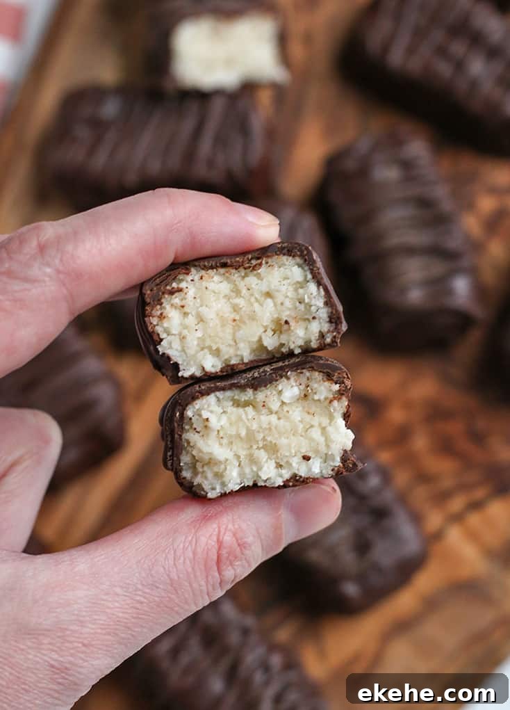 hand holding a paleo vegan mounds candy bar