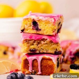 stack of fudgy blueberry brownies with lemon and swirled glaze