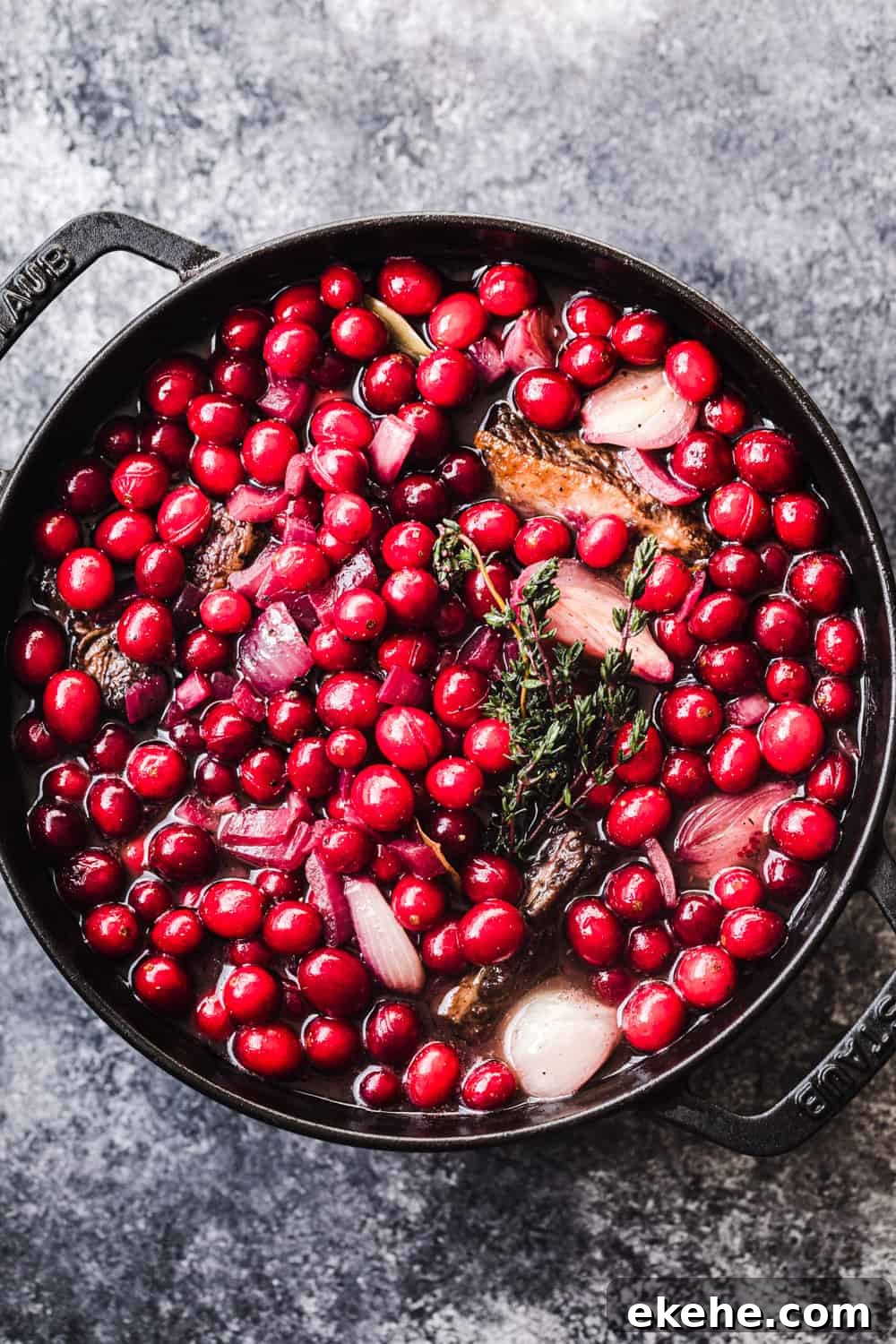 In process shot of Fresh Cranberry and Red Wine Short ribs - pre-braising in the oven