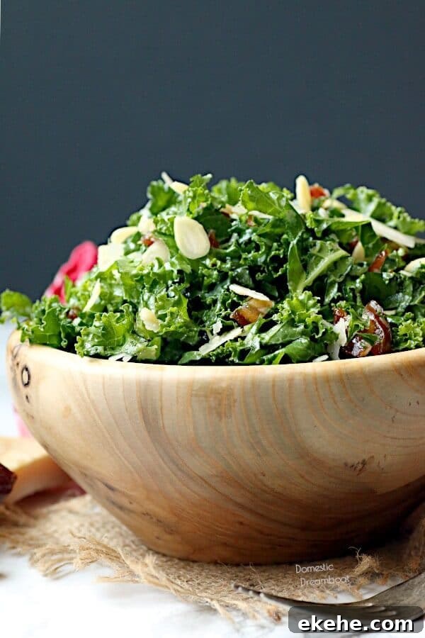 Kale and date salad in a wood bowl.