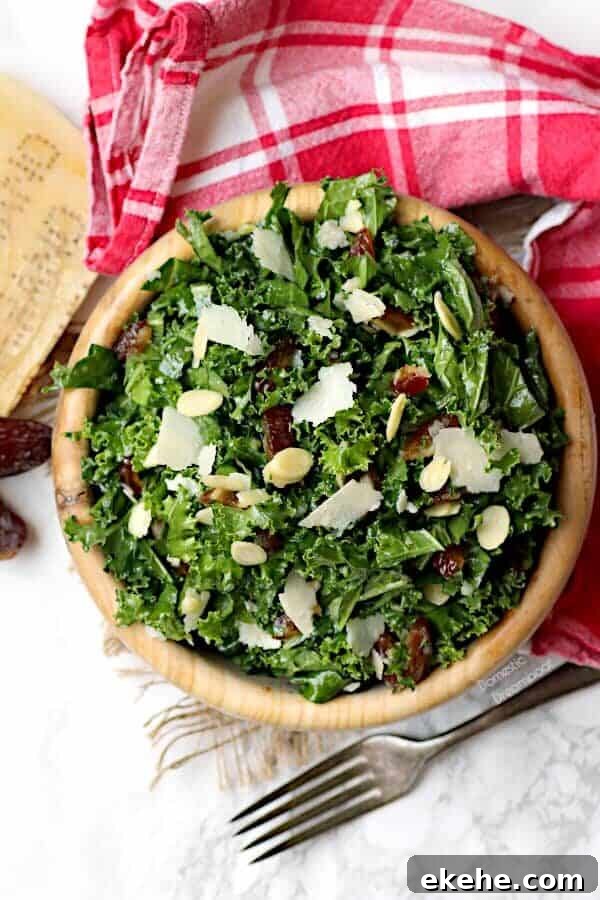 Overhead photo of kale and date salad in a wood bowl.