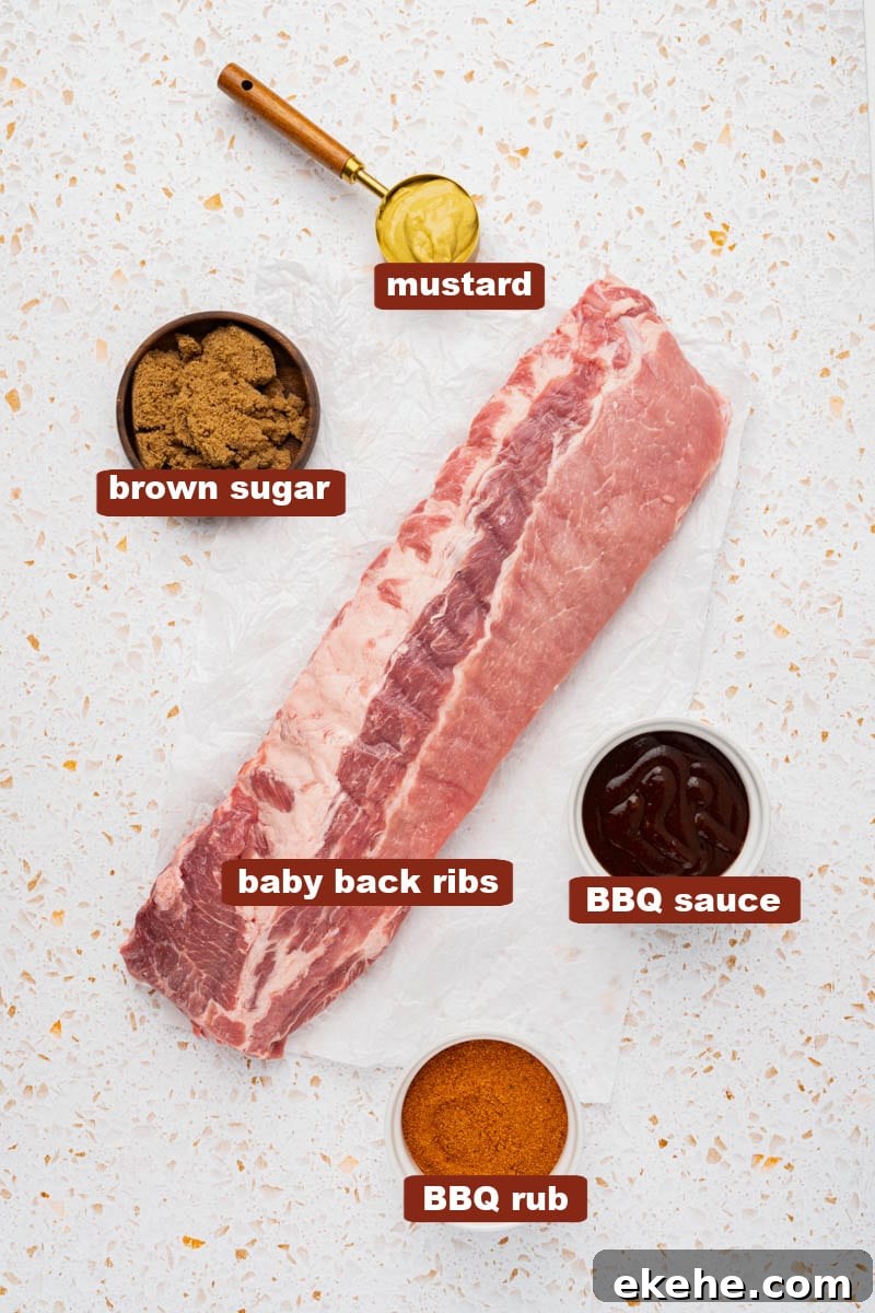 All of the ingredients for ribs on a white countertop including baby back ribs, bbq rub, mustard, brown sugar and bbq sauce. 