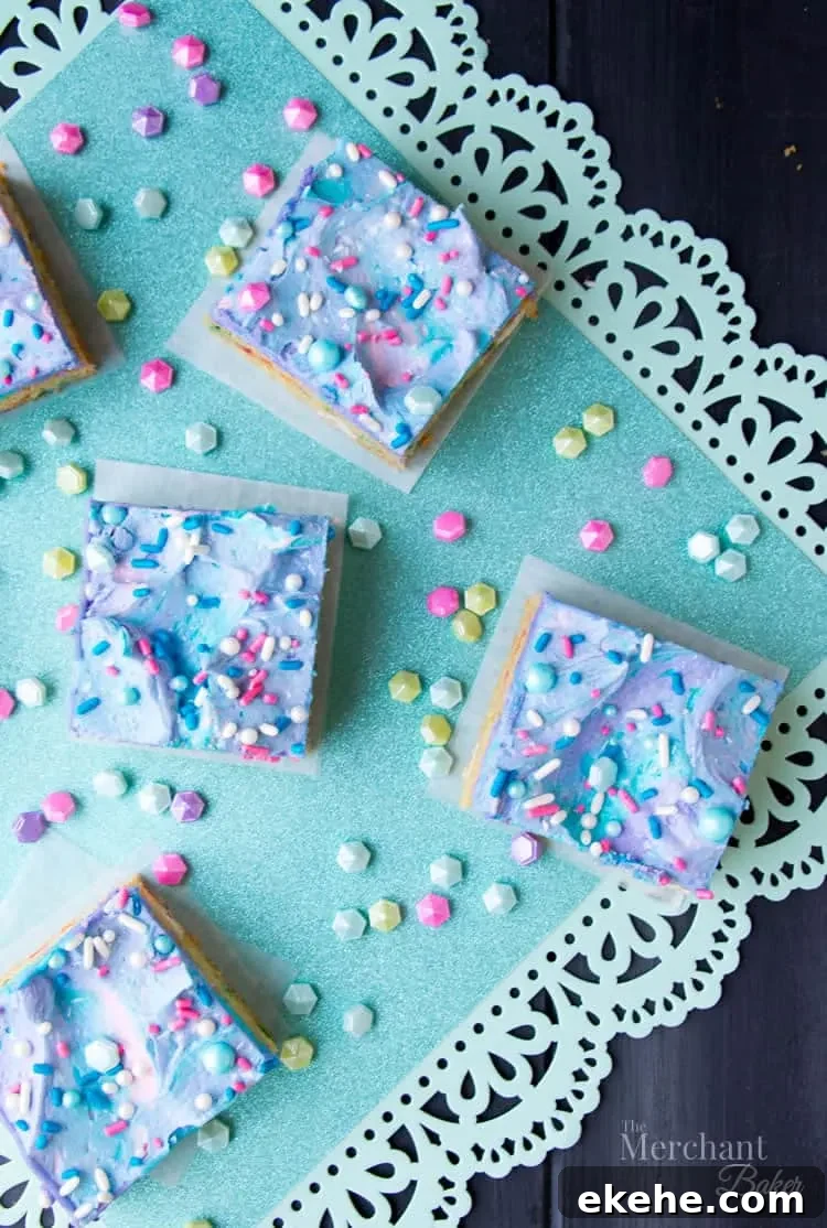 Mermaid Birthday Sugar Cookie Bars. Birthday cake flavored sugar cookie bars, topped with colorful swirls of frosting and festive sprinkles.