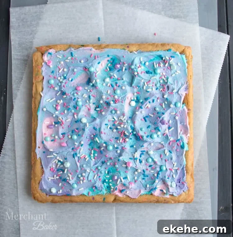 Mermaid Birthday Sugar Cookie Bars. Birthday cake flavored sugar cookie bars, topped with colorful swirls of frosting and festive sprinkles.