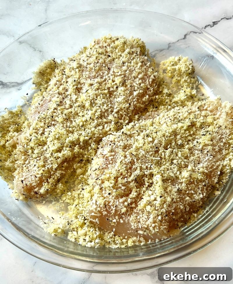 Chicken pieces dredged in the breadcrumb mixture.