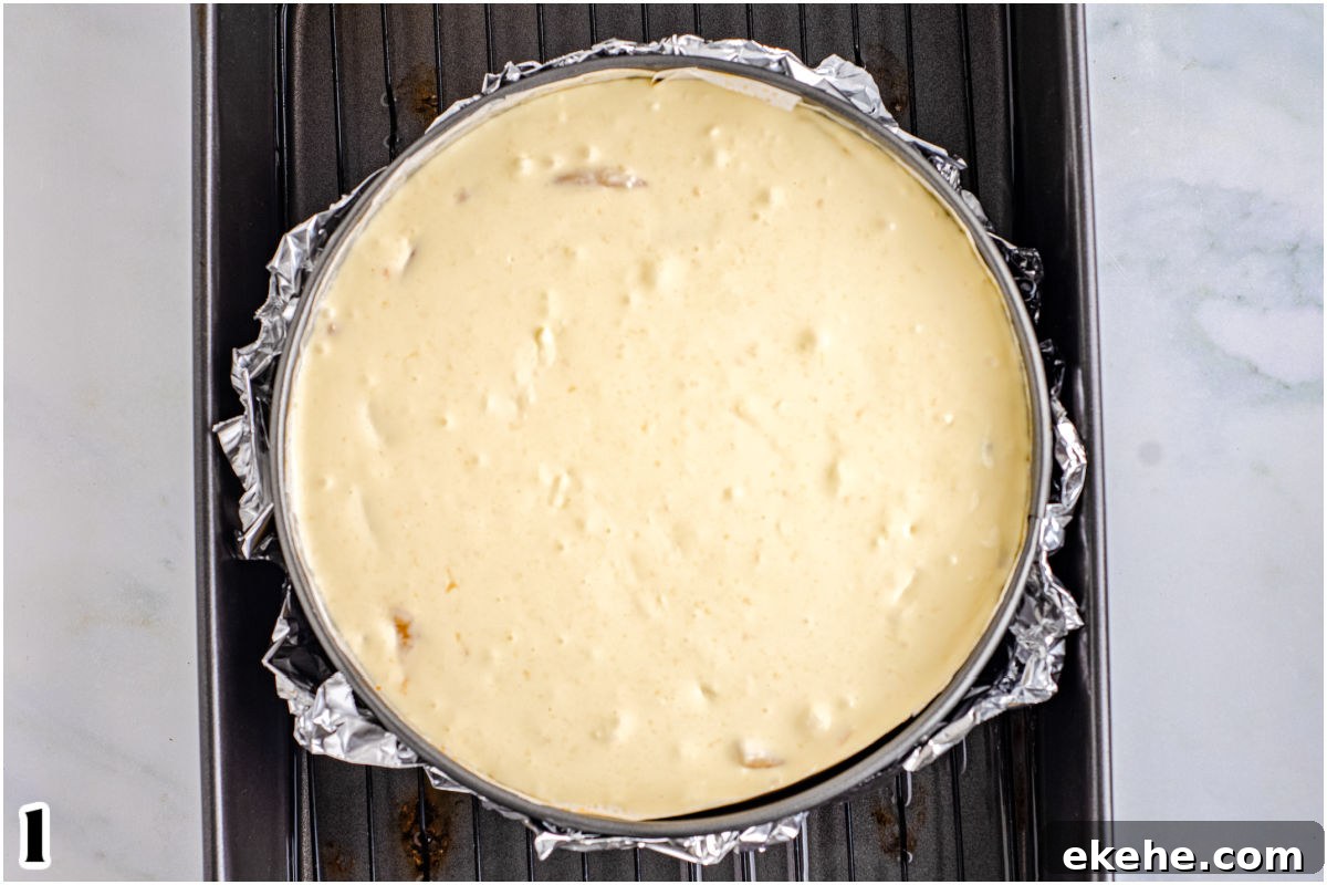The cheesecake filling in a springform pan ready to be baked.