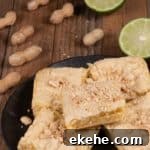 pieces of West African Lime cake called Keke cut into squares and topped with peanuts
