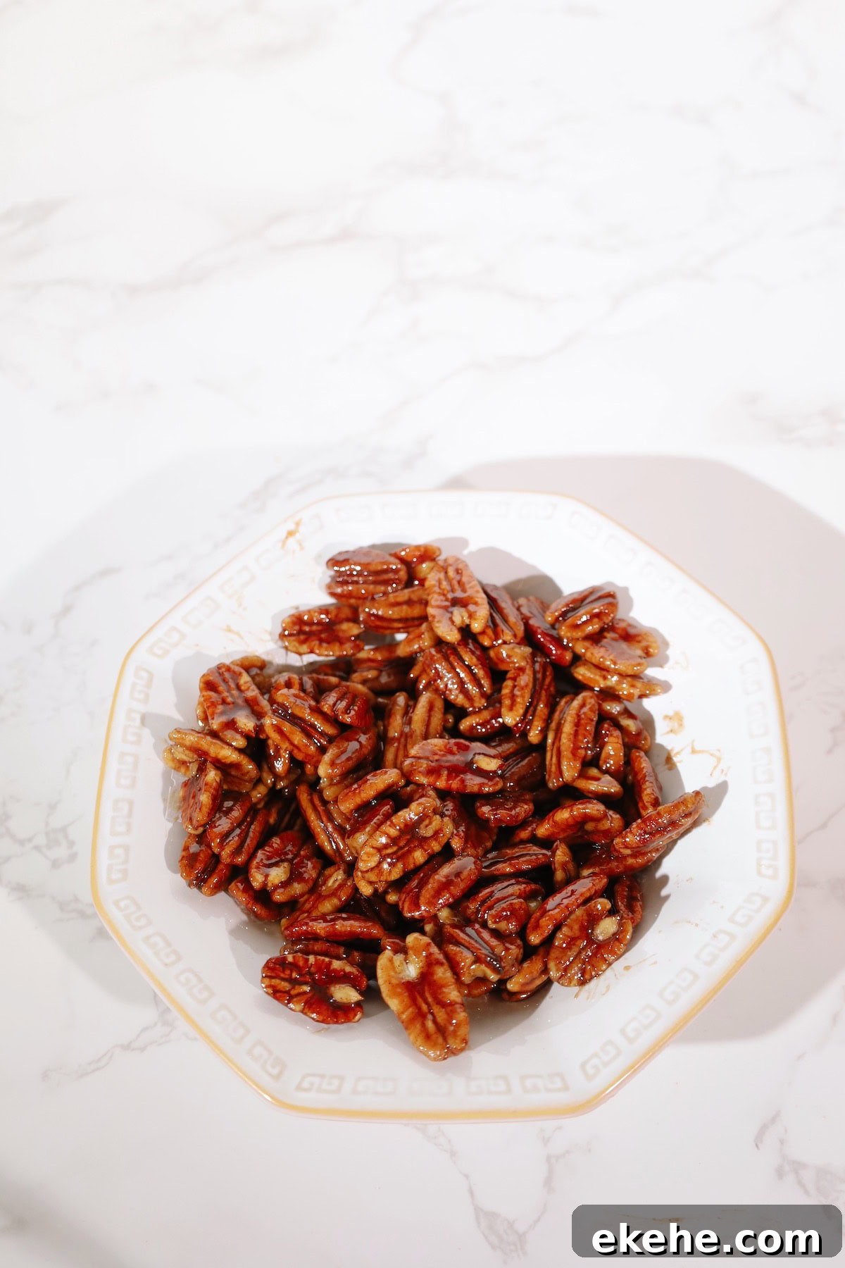 Candied pecans recipe on a plate.