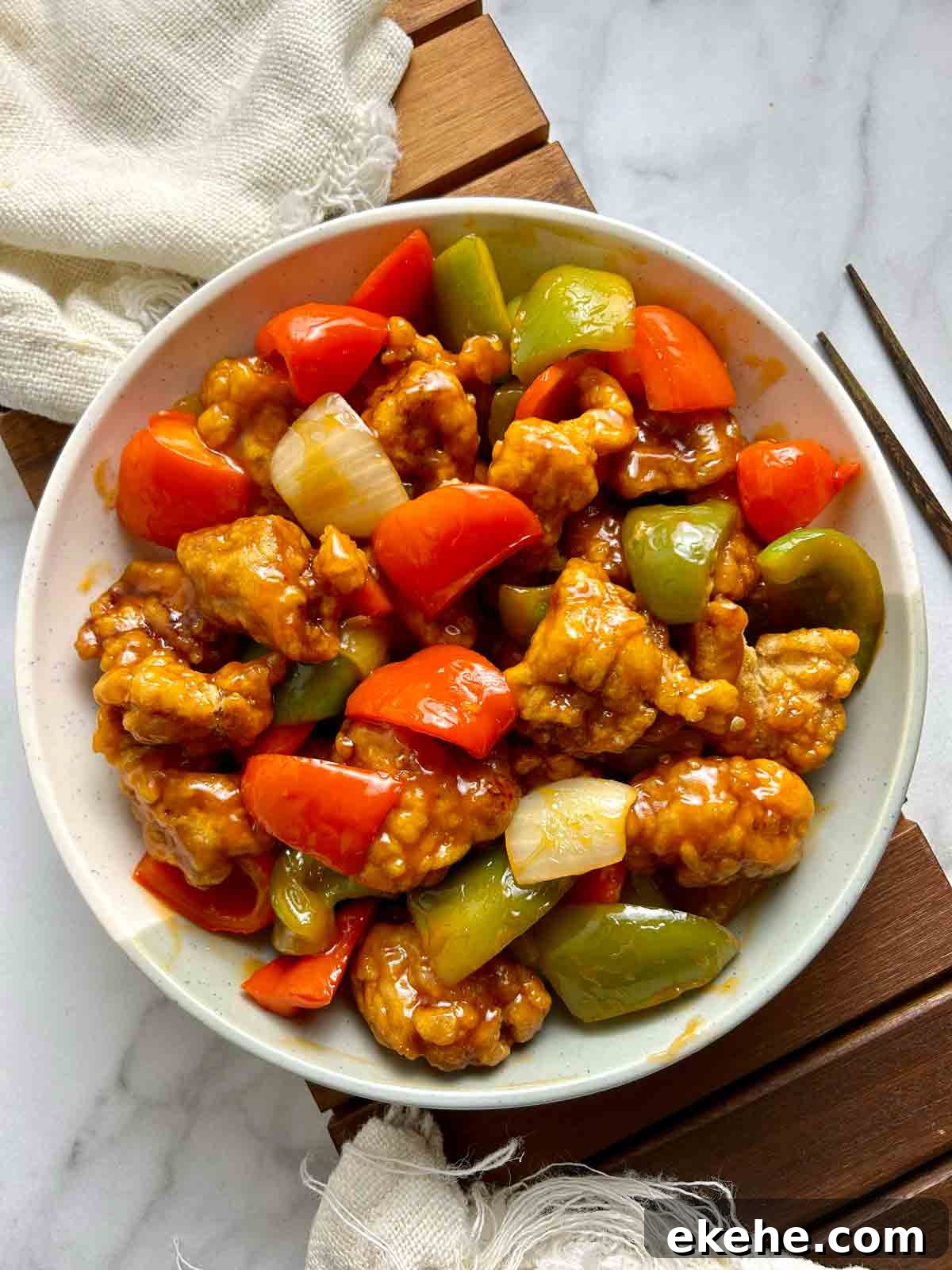overhead view of sweet and sour pork on plate.