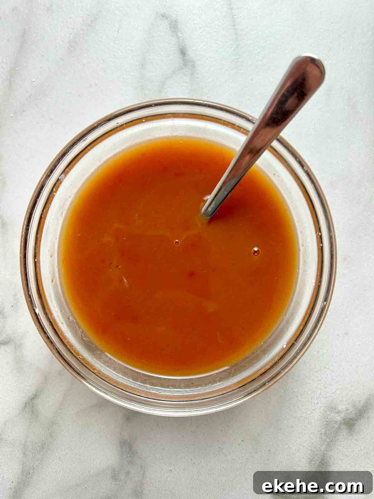 sweet and sour sauce ingredients mixed in small bowl.