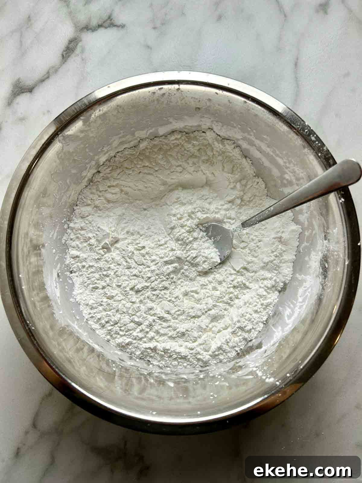 starch mixture being mixed in bowl.