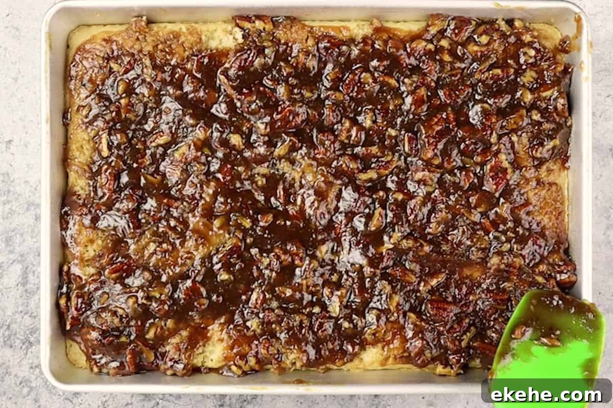 adding pecan pie topping to cake