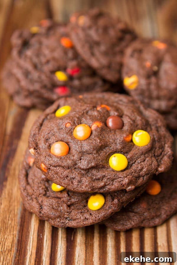 I can't eat these fast enough! Chocolate Reese's Pieces Cookies ohsweetbasil.com