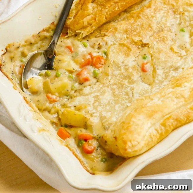 A vegetarian pot pie topped with puff pastry.