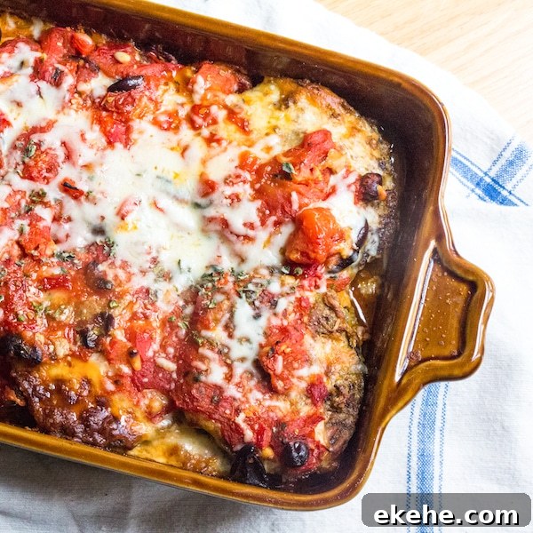 Finished eggplant parmesan with cheese and roasted tomato sauce.