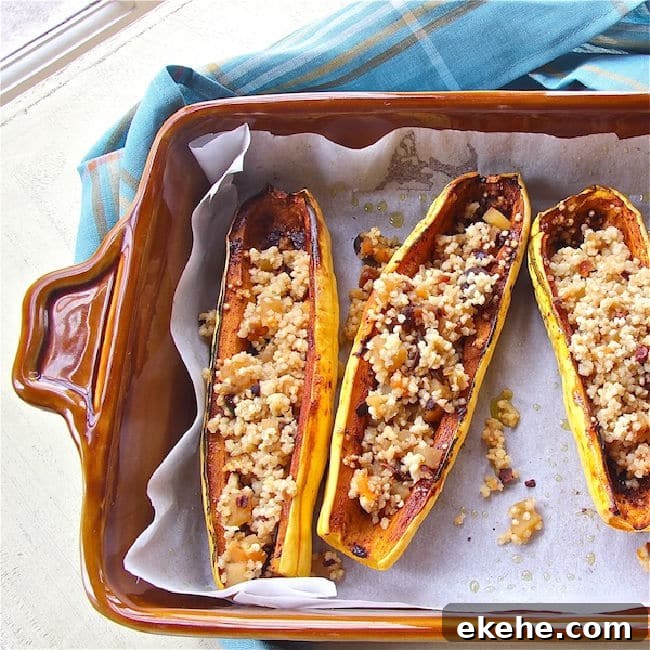 Roasted Delicata squash halves, stuffed with quinoa and dried fruit stuffing.