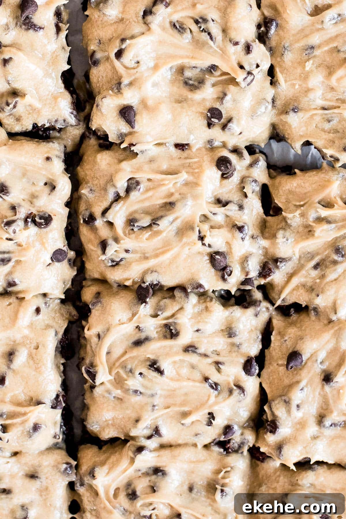 close up of brownies topped with chocolate chip frosting