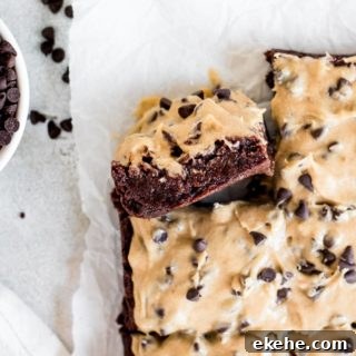 side of brownie showing layers of brownie and frosting