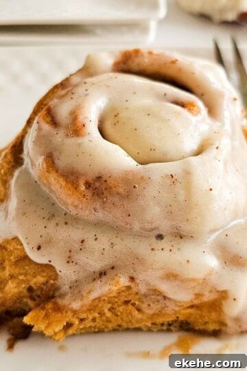 tall and fluffy glazed cinnamon roll