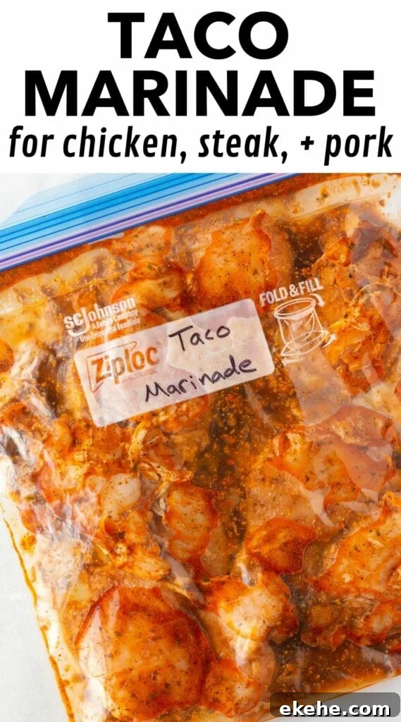 Pin for taco marinade with black test on a white background at the top reading "taco marinade for chicken, steak, + pork" and the bottom ¾ of the pin showing an image of chicken in the taco marinade in a plastic ziploc bag.