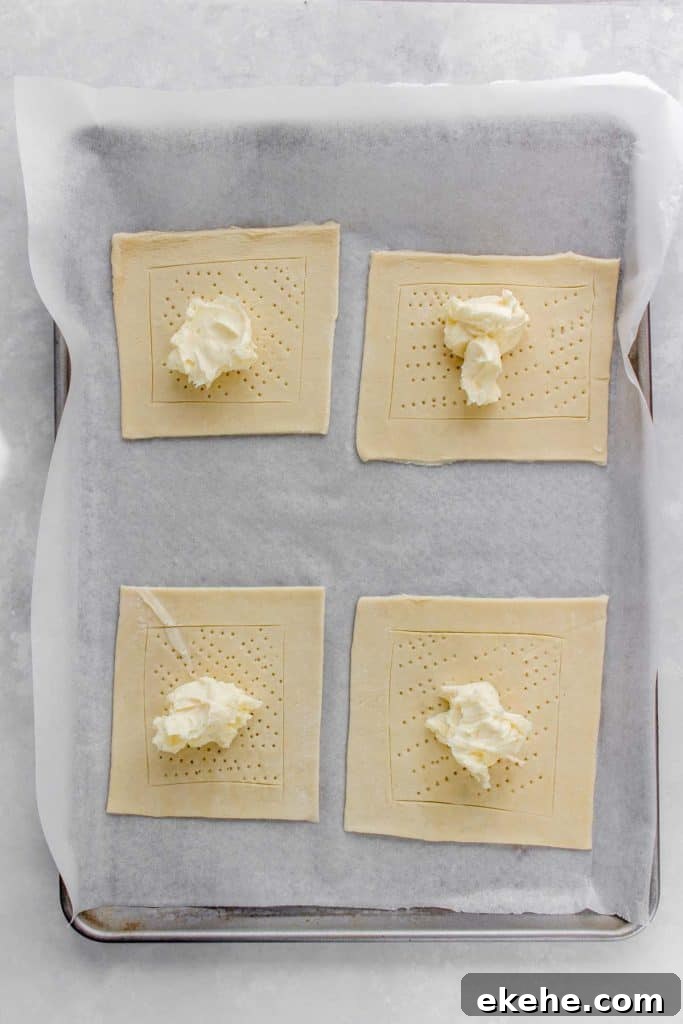 Cream cheese mixture added to puff pastry.