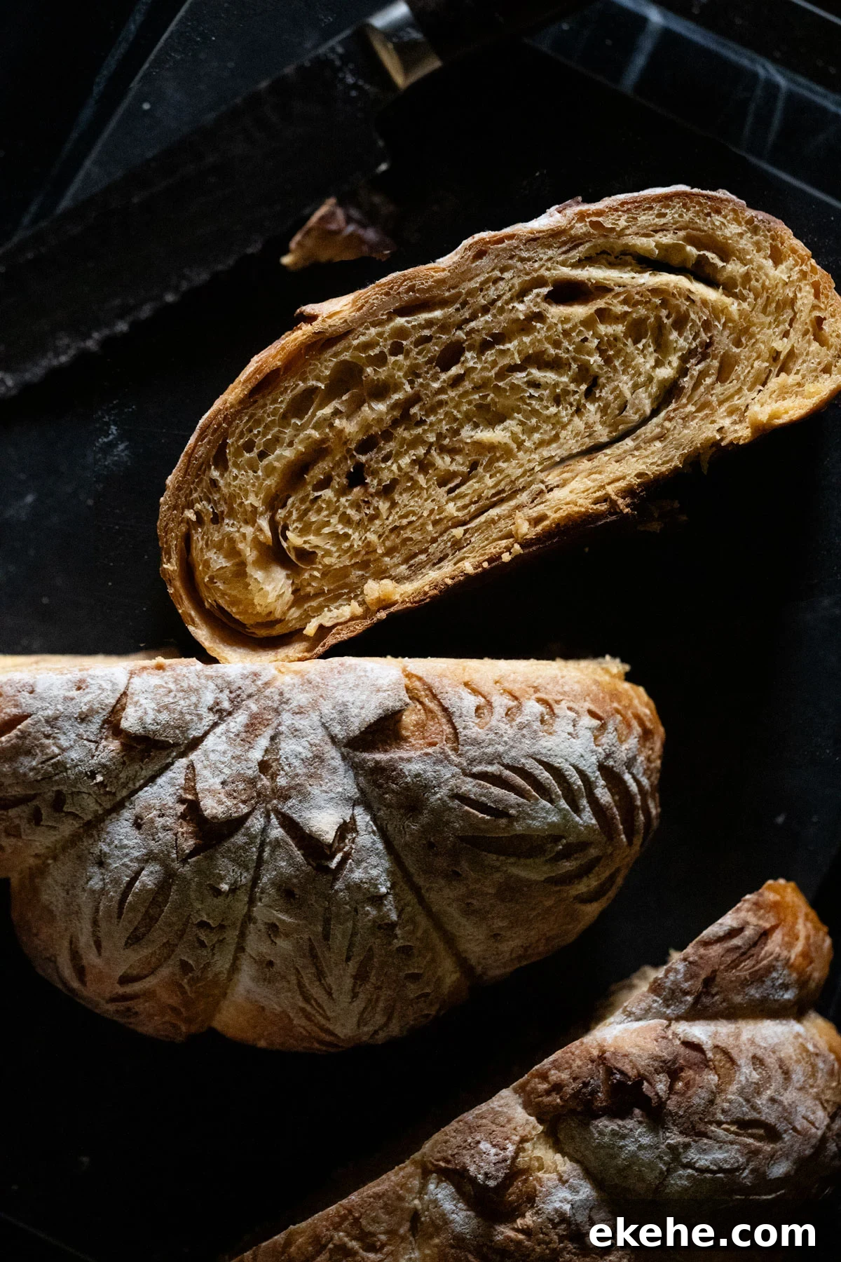 Pumpkin sourdough with a sugar cinnamon swirl sliced and showing the pumpkin shaping