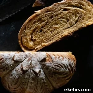 Pumpkin sourdough with a sugar cinnamon swirl sliced and showing the pumpkin shaping