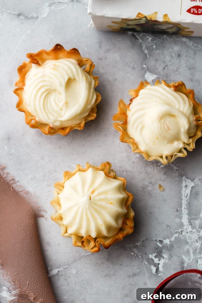 filling piped into phyllo shells