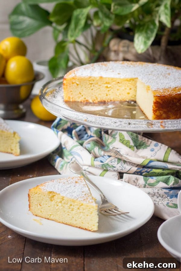 Italian lemon ricotta cake on cake stand. Slices of cake on white plates with colorful napkin to the side and lemons behind.