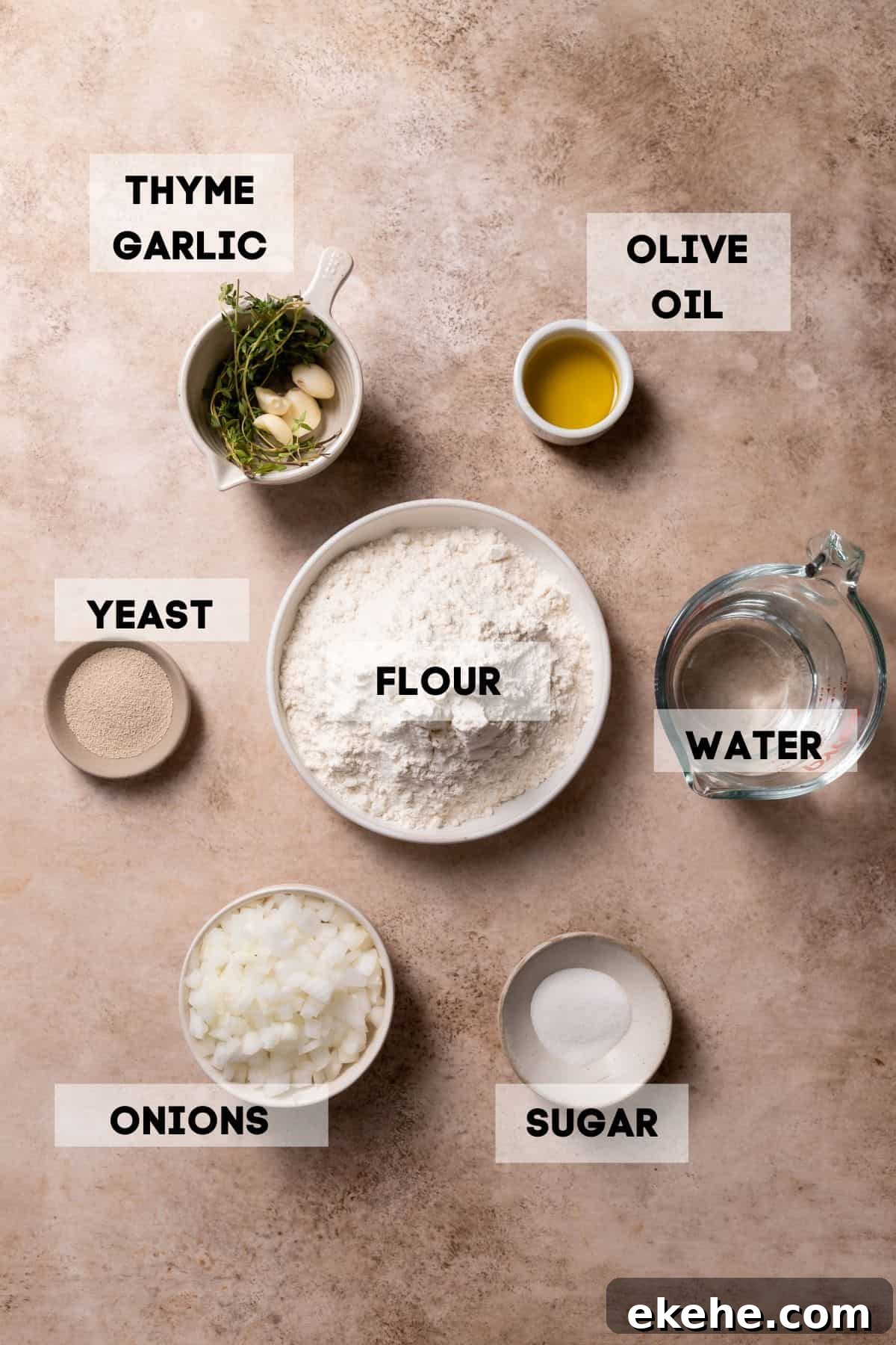 ingredients needed to make caramelized onion focaccia in bowls with labels.