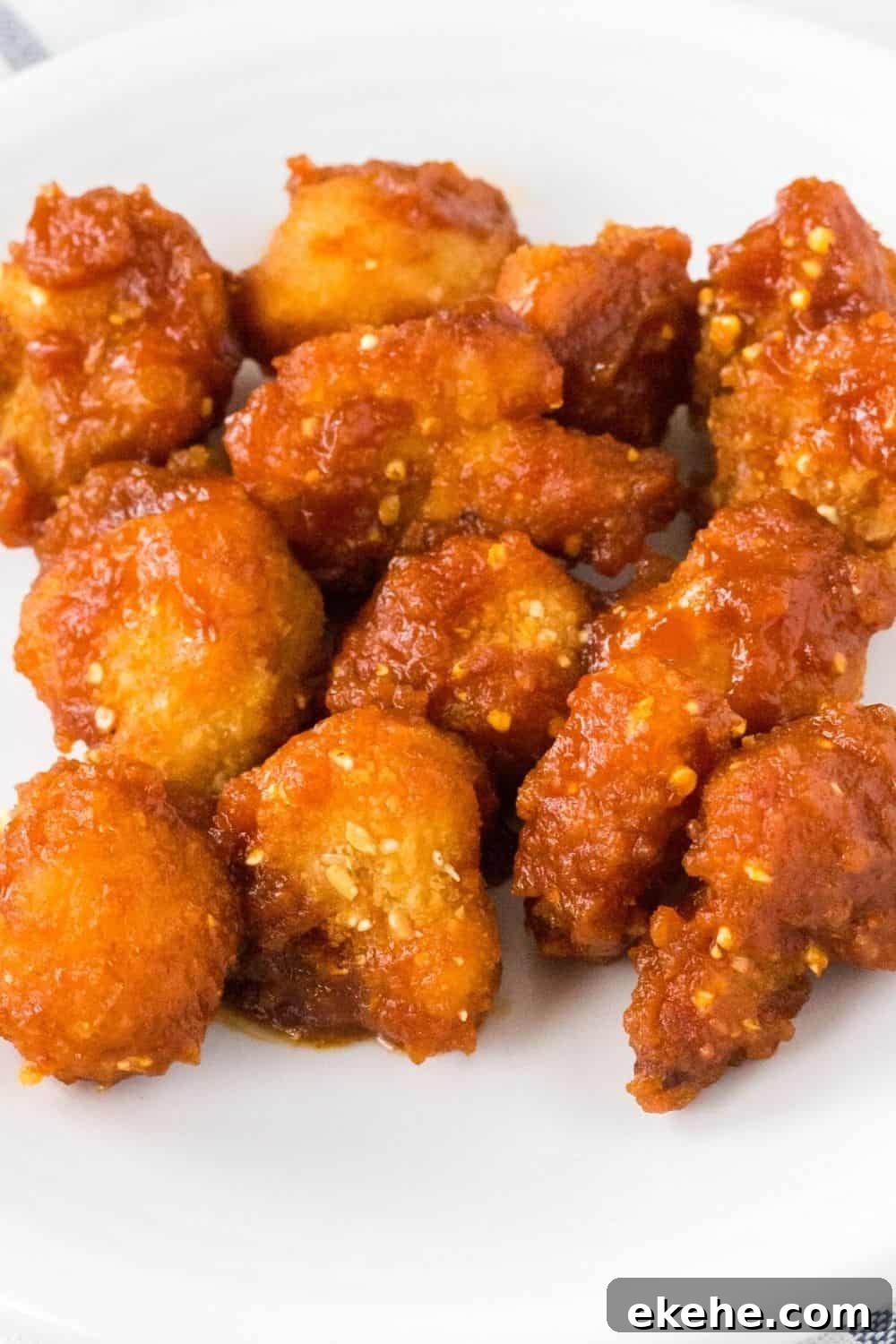 air fryer Birdseye cauliflower wings with bbq sauce on a white plate