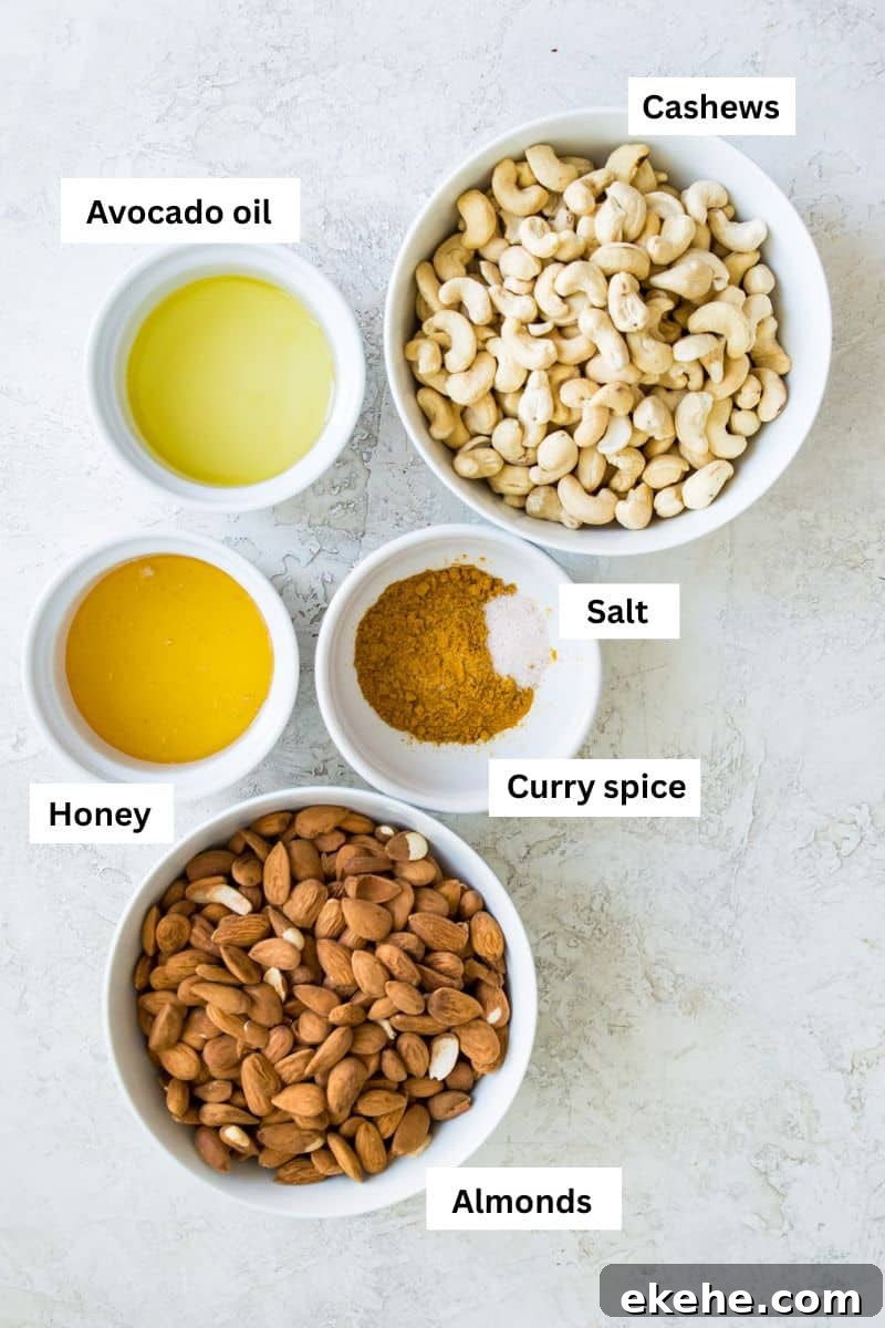 Sweet Curry-Glazed Cashews & Almonds: Spiced Snack Recipe 3 Different foods separated into bowls including cashews, almonds, honey, oil and curry spice.