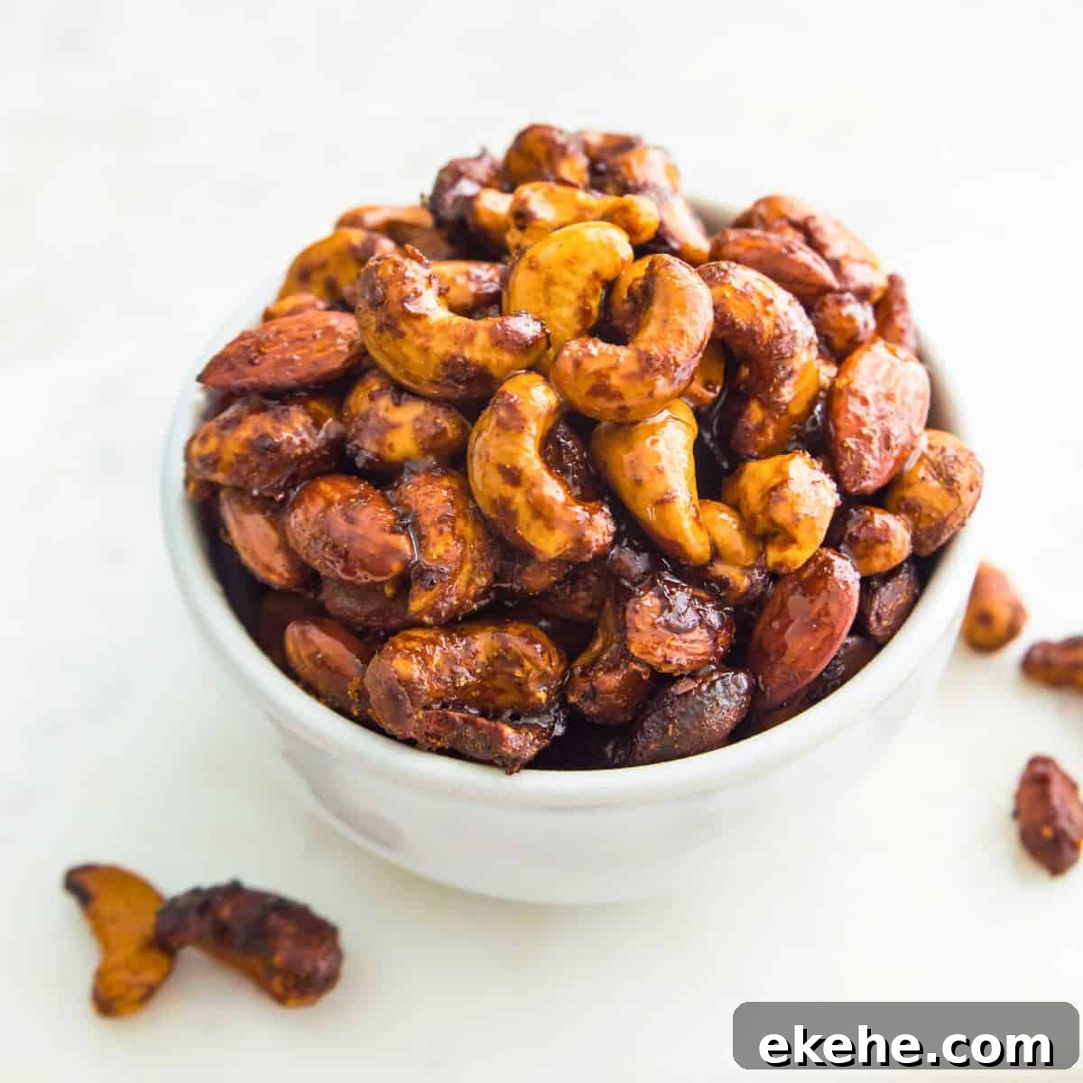 Sweet Curry-Glazed Cashews & Almonds: Spiced Snack Recipe 7 Glazed cashews and almonds in a bowl.