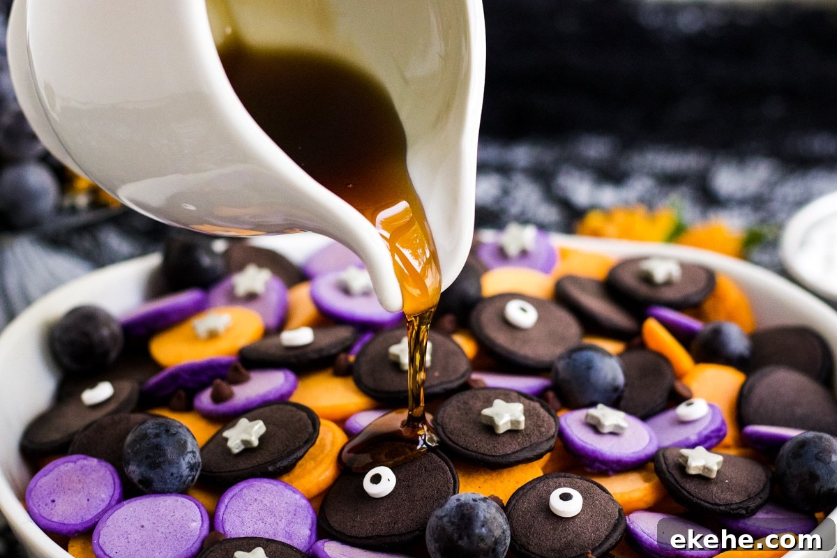 Syrup being poured on Halloween Pancake Cereal.