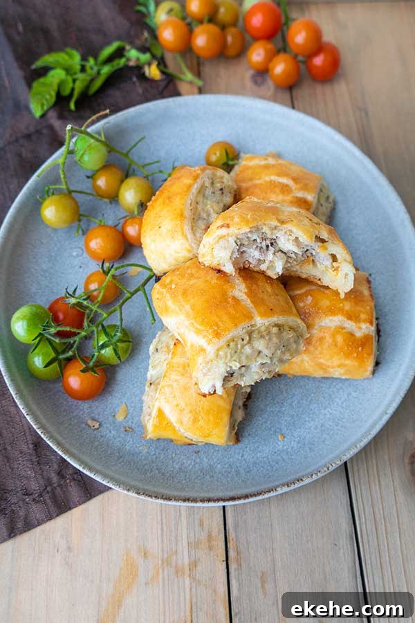 gluten free sausage rolls with tomatoes on a plate