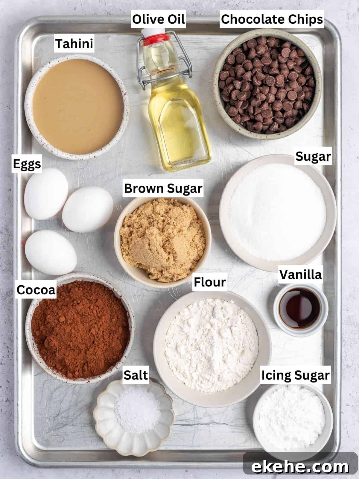 Tahini Brownies recipe ingredients with individual labels on a metal tray.