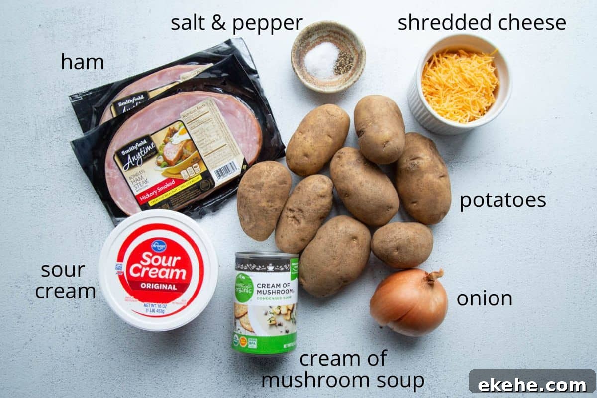 potatoes, ham, cheese, cream of mushroom soup, and other ingredients on a white table.