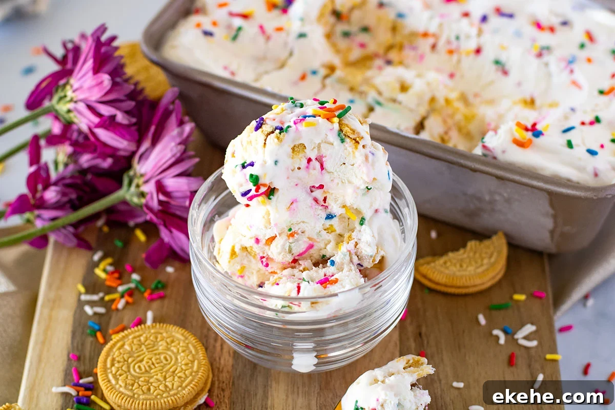 Golden Oreo vanilla ice cream in glass dessert bowl with sprinkles on top.