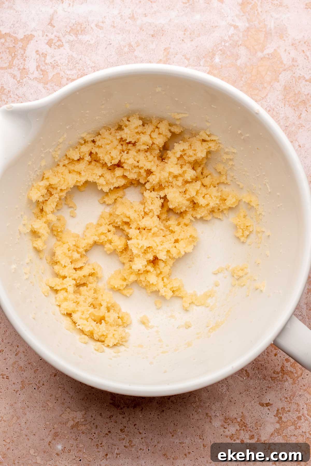 Creamed butter and sugar in a bowl.