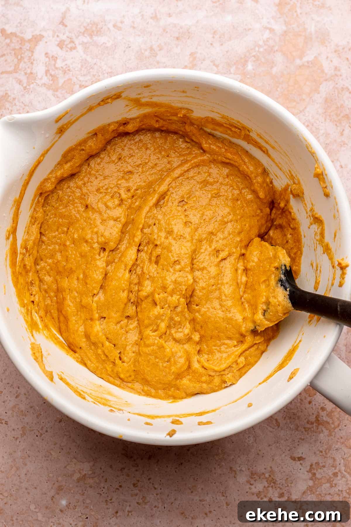 Finished pumpkin cake batter in a bowl.