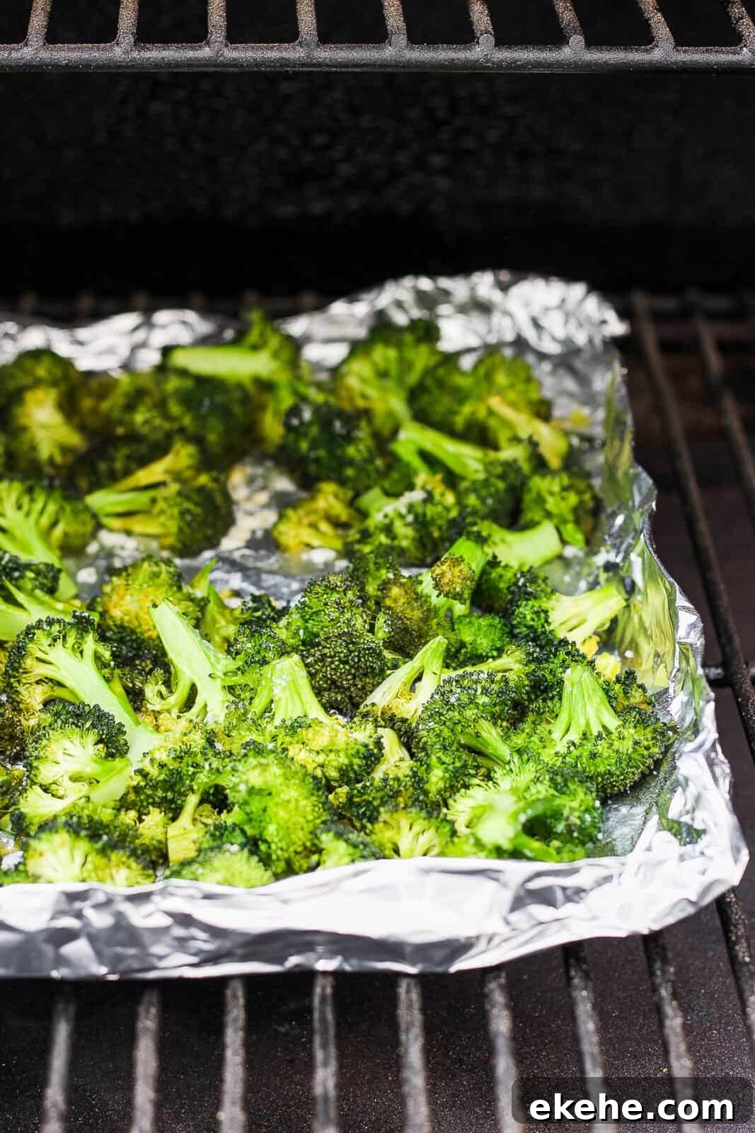 Broccoli smoking on the smoker.