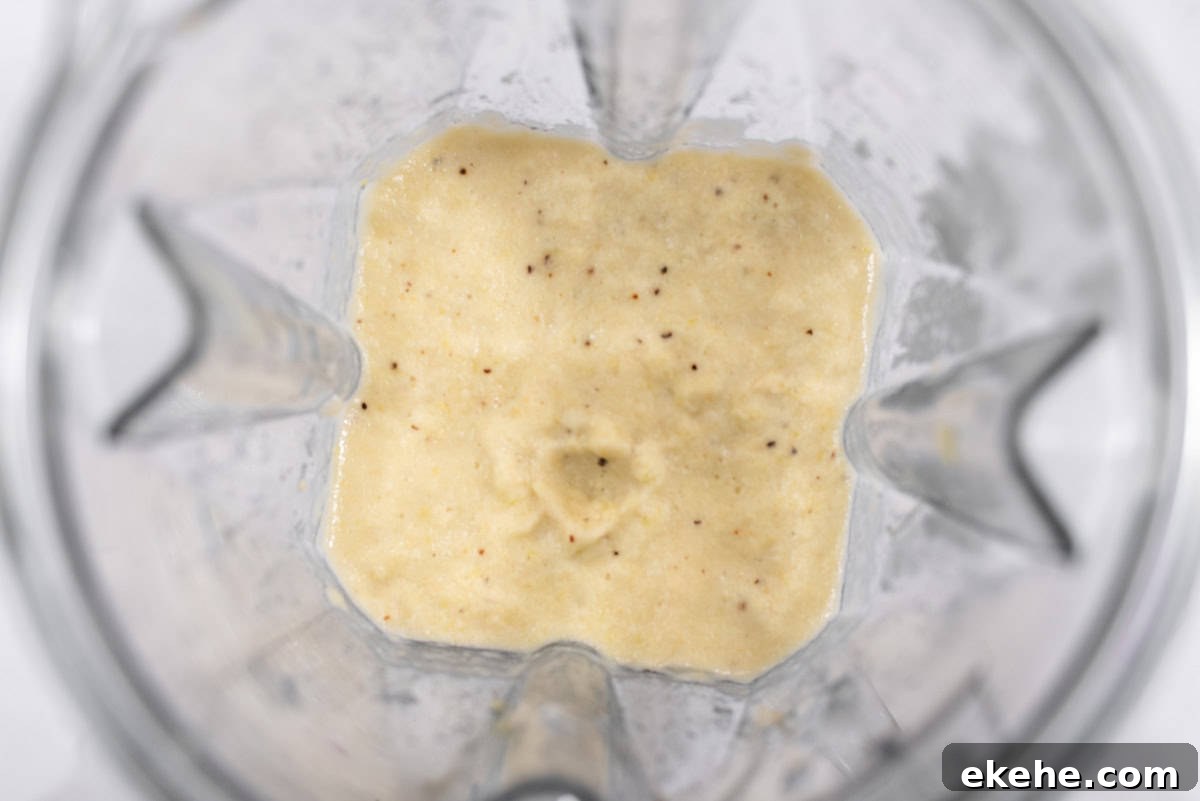 Corn pureed with other ingredients in blender.